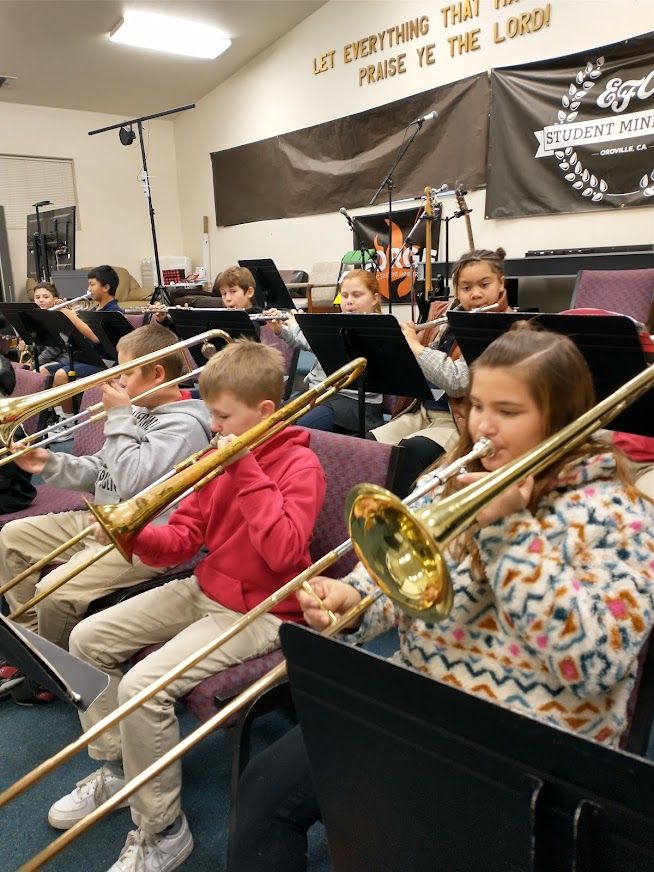 young students in band program