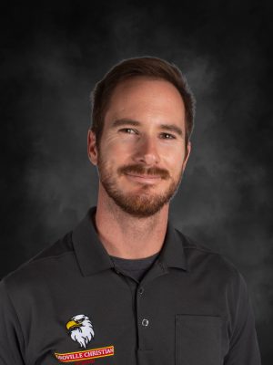 Mr. Richard Haynes, Oroville Christian School staff member, smiles in a gray polo shirt.
