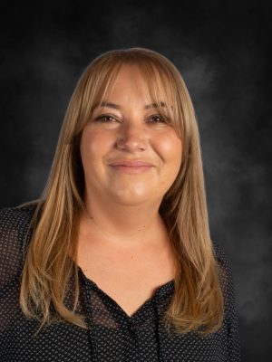 Portrait of Mrs. Rebecca Billington, a smiling woman with blonde hair.