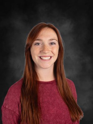 Mrs. Samantha Schillig, a smiling woman with red hair, portrait.